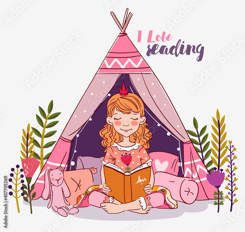 Cute little girl with crown reading a book. Beautiful princess