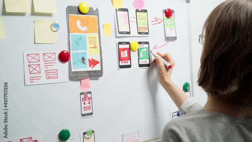 Mobile phone app developers create sketches. Website designers are working on the project interface. Mobile phone app developers create sketches. Website designers are working on the project interface.