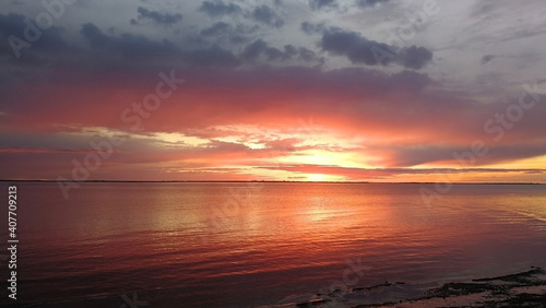 Soft orange sunset on the white Sea coast of northern Russia