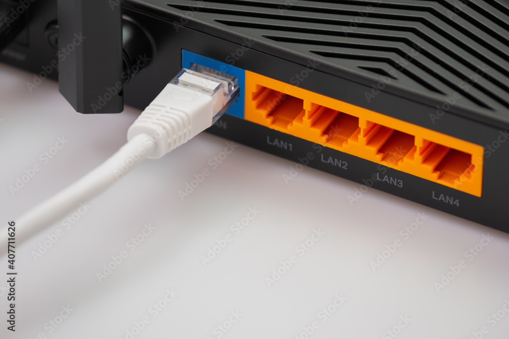 Wireless internet router with connected cables Wireless internet router with connected cables