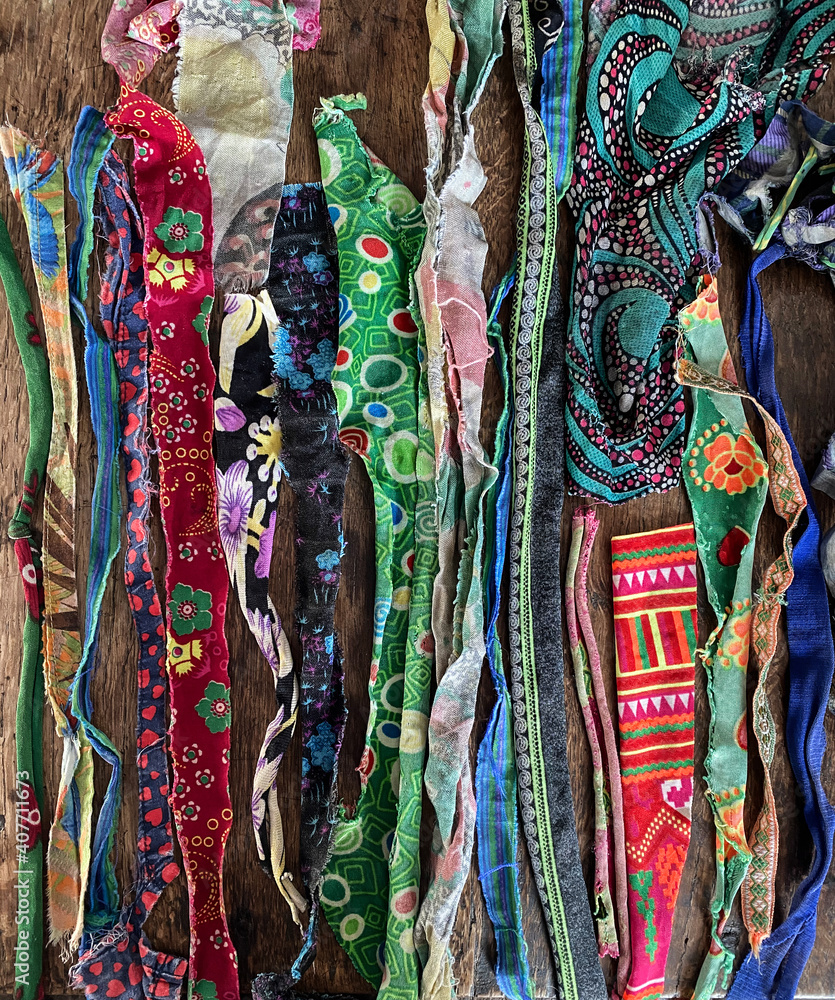 Assortment of many colorful pieces of torn cloth