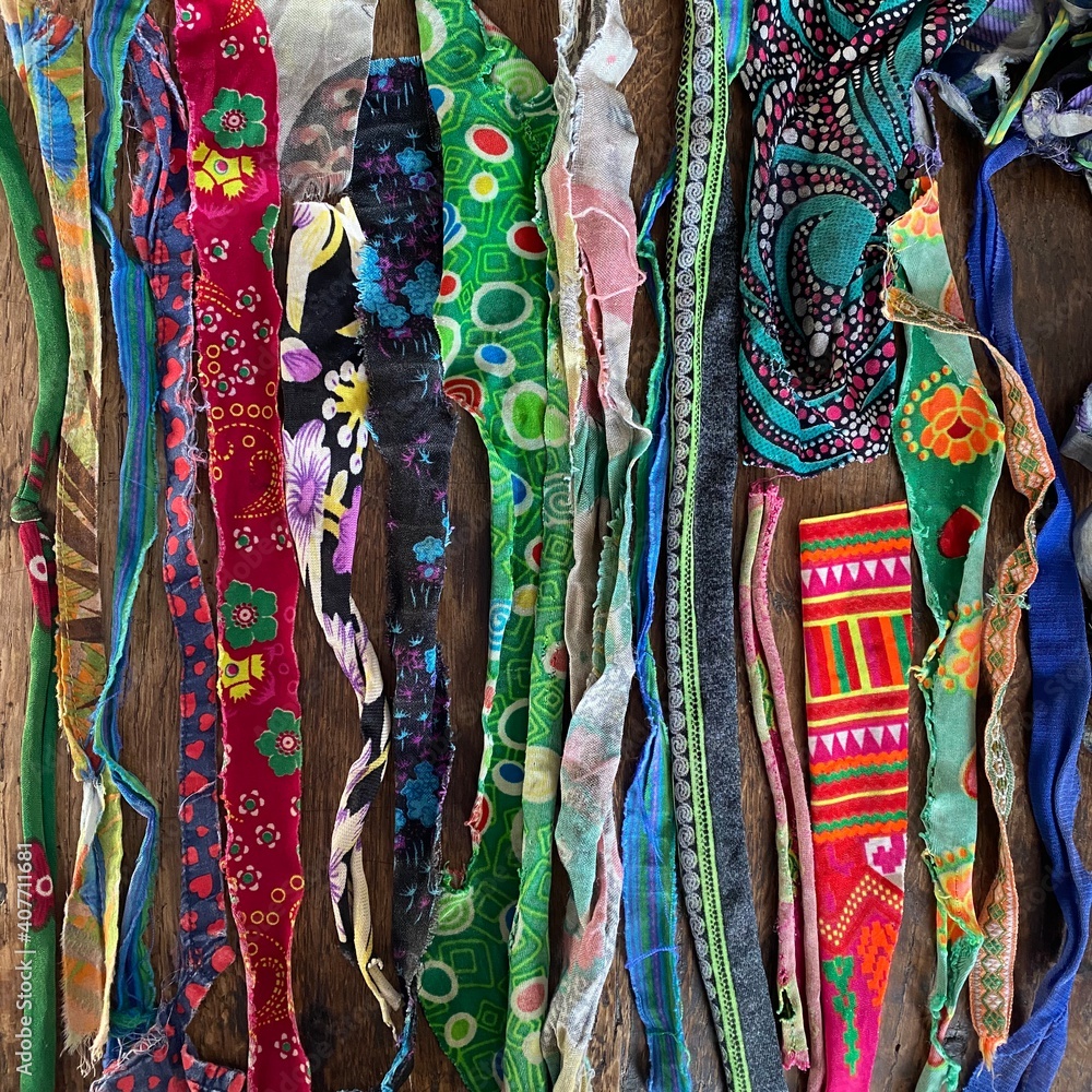 Assortment of many colorful pieces of torn cloth