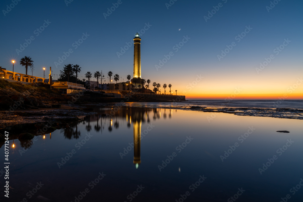 Fototapeta premium horizontal view of the Chipiona lighthouse in Andalusia at sunset