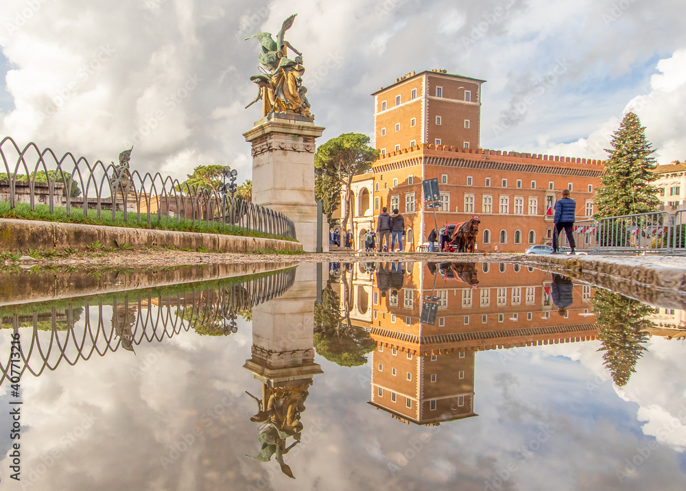 Rome, Italy - in Winter time, frequent rain showers create pools in which the wonderful Old Town of Rome reflect like in a mirror. Here in particular Piazza Venezia