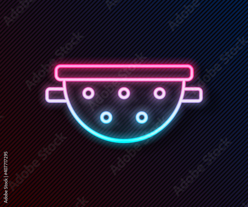 Glowing neon line Kitchen colander icon isolated on black background. Cooking utensil. Cutlery sign. Vector.