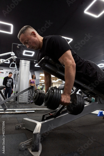 Man in the training gym  working hard after quarantine.