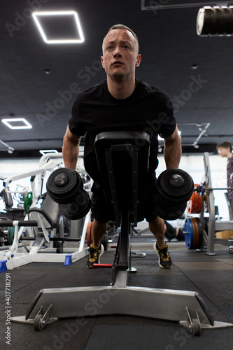 Man in the training gym  working hard after quarantine.
