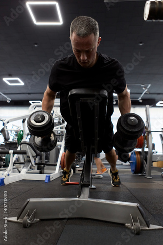 Man in the training gym  working hard after quarantine.