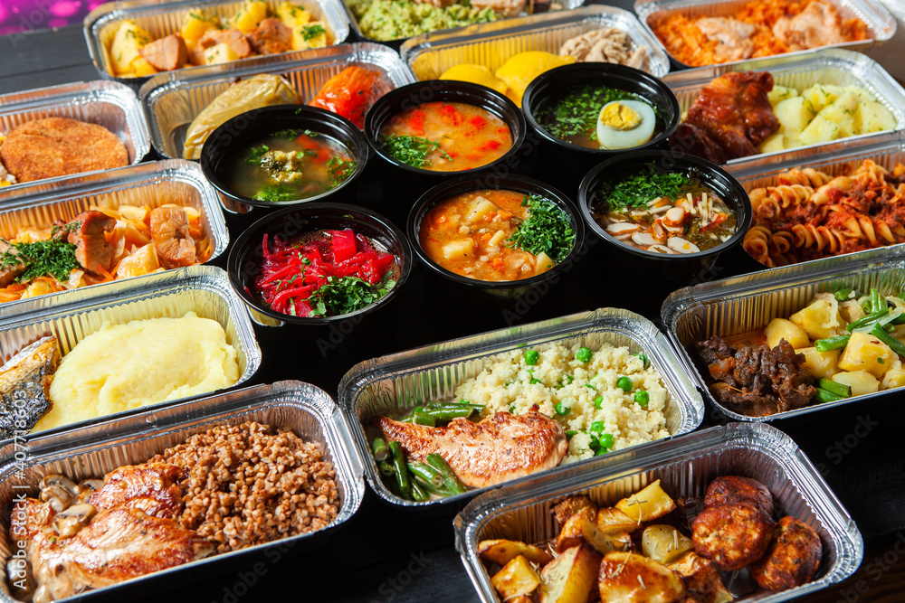 Business lunch in eco plastic container ready for delivery.Top view. Office Lunch boxes with food ready to go. Food takes away. Catering, brakfast