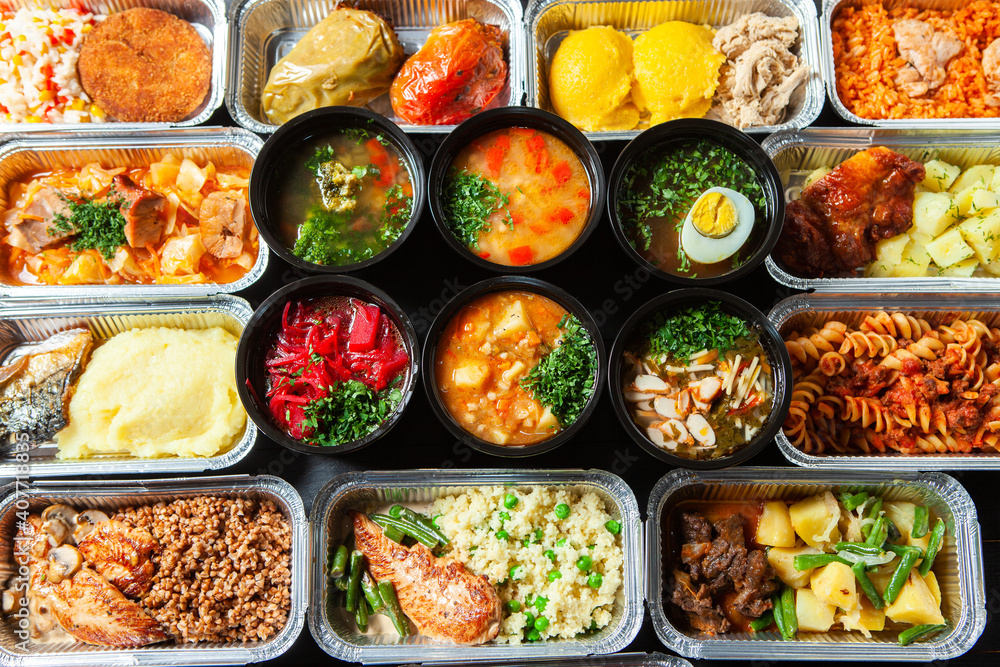 Business lunch in eco plastic container ready for delivery.Top view. Office Lunch boxes with food ready to go. Food takes away. Catering, brakfast Business lunch in eco plastic container ready for delivery.Top view. Office Lunch boxes with food ready to go. Food takes away. Catering, brakfast