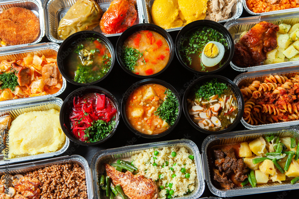 Business lunch in eco plastic container ready for delivery.Top view. Office Lunch boxes with food ready to go. Food takes away. Catering, brakfast Business lunch in eco plastic container ready for delivery.Top view. Office Lunch boxes with food ready to go. Food takes away. Catering, brakfast