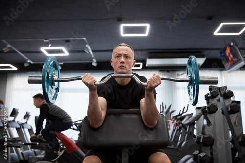 Man in the training gym  working hard after quarantine.