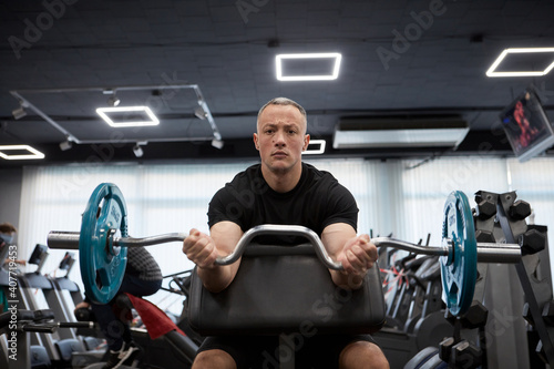 Man in the training gym  working hard after quarantine.