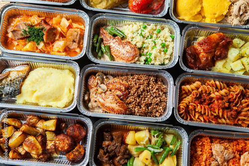 Business lunch in eco plastic container ready for delivery.Top view. Office Lunch boxes with food ready to go. Food takes away. Catering, brakfast. © romeof