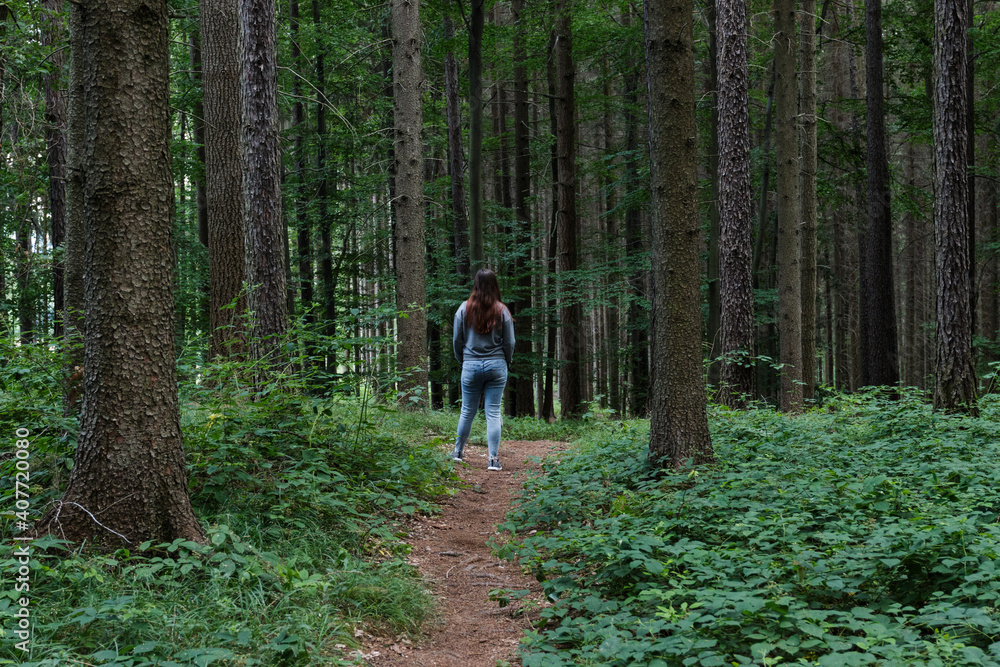 Girl in the forest of Czech republic back long hair jeans Girl in the forest of Czech republic back long hair jeans