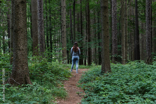 Girl in the forest of Czech republic back long hair jeans