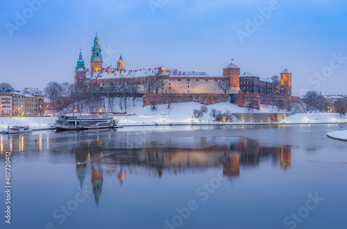Krakow winter, night / morning Wawel Castle over Vistula river, snow, Poland
