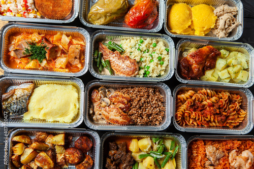 Business lunch in eco plastic container ready for delivery.Top view. Office Lunch boxes with food ready to go. Food takes away. Catering, brakfast.