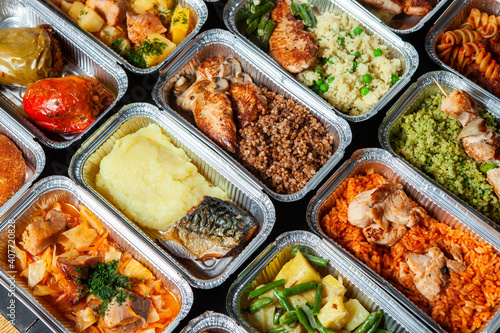 Business lunch in eco plastic container ready for delivery.Top view. Office Lunch boxes with food ready to go. Food takes away. Catering, brakfast.