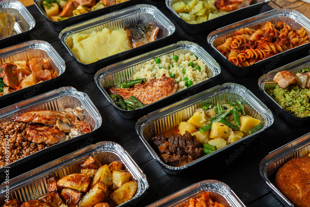 Business lunch in eco plastic container ready for delivery.Top view. Office Lunch boxes with food ready to go. Food takes away. Catering, brakfast.