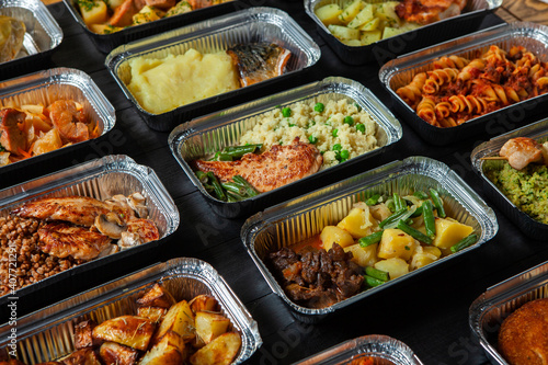 Business lunch in eco plastic container ready for delivery.Top view. Office Lunch boxes with food ready to go. Food takes away. Catering, brakfast.