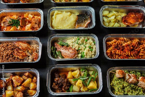 Business lunch in eco plastic container ready for delivery.Top view. Office Lunch boxes with food ready to go. Food takes away. Catering, brakfast.