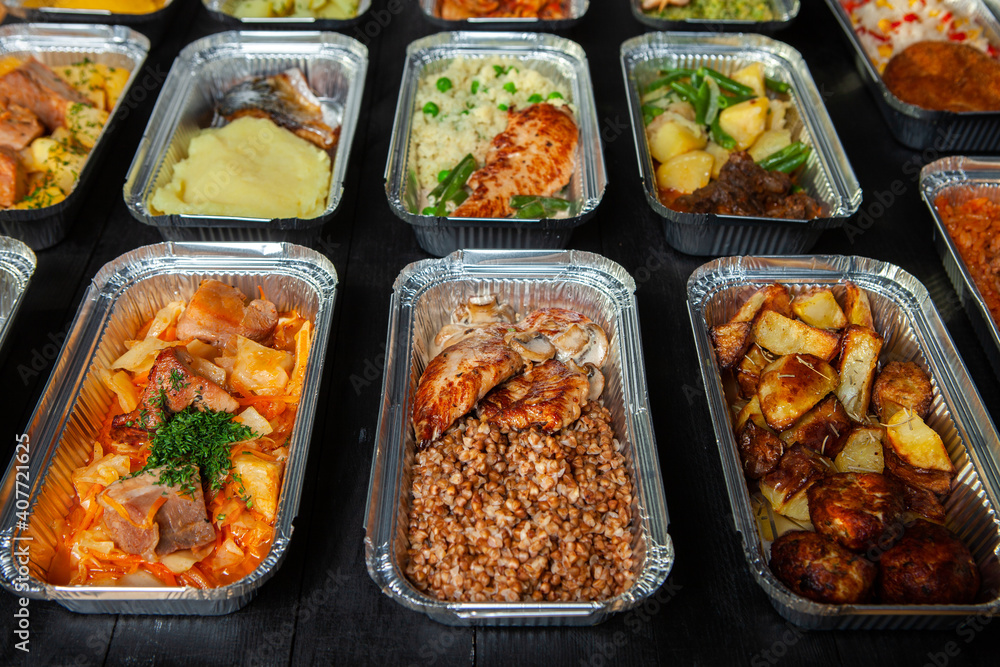 Business lunch in eco plastic container ready for delivery.Top view. Office Lunch boxes with food ready to go. Food takes away. Catering, brakfast. Business lunch in eco plastic container ready for delivery.Top view. Office Lunch boxes with food ready to go. Food takes away. Catering, brakfast.