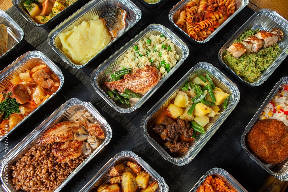 Business lunch in eco plastic container ready for delivery.Top view. Office Lunch boxes with food ready to go. Food takes away. Catering, brakfast.