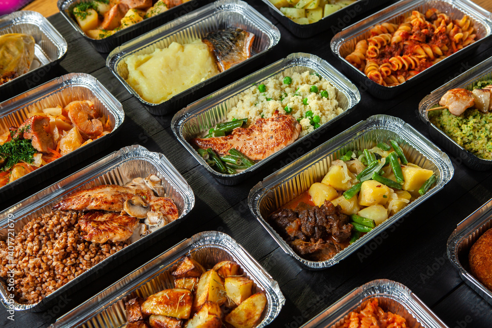 Business lunch in eco plastic container ready for delivery.Top view. Office Lunch boxes with food ready to go. Food takes away. Catering, brakfast. Business lunch in eco plastic container ready for delivery.Top view. Office Lunch boxes with food ready to go. Food takes away. Catering, brakfast.