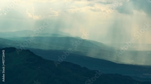 background, rain over mountain ranges