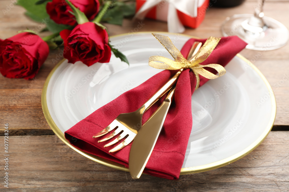 Beautiful table setting for Valentine's Day dinner on wooden background, closeup