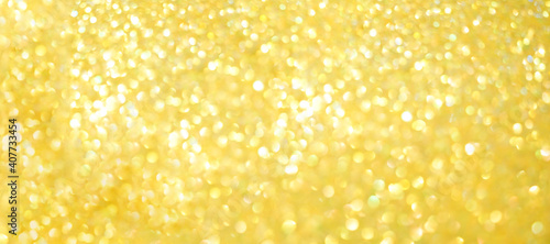Festive yellow background with sequins and rhinestones