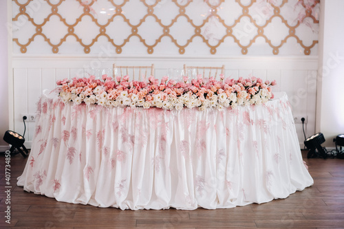 wedding table decoration with flowers on the table in the castle, table decor for dinner by candlelight.Dinner with candles photo