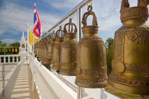 Brass bell hanging by a long line (wat phuthong thepnimit Temple)