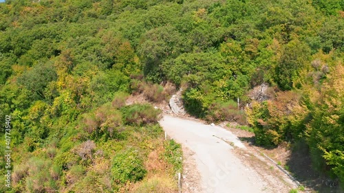 Top view from drone. Mount Chelobrdo above Budva. Country road high in the mountains. The road is high in the mountains. Montenegro. Mountains over Budva.
 photo