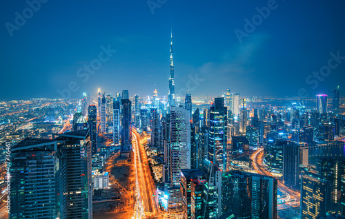 Obraz na płótnie Modern Dubai city skyline at the sunset and beautiful city center, Dubai, United Arab Emirates w salonie