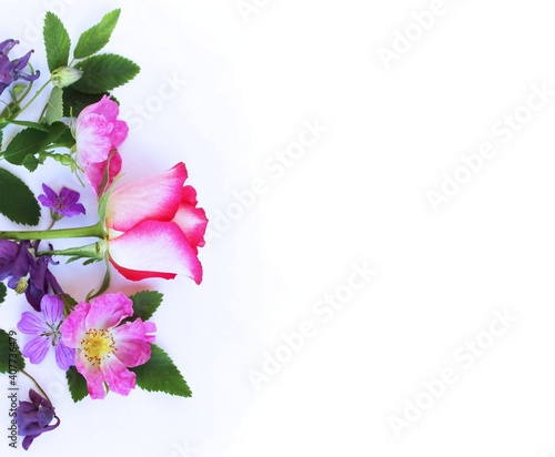 A delicate spring bouquet with roses and astromeria on a white background. Soft pastel shades. Background for a greeting card. photo