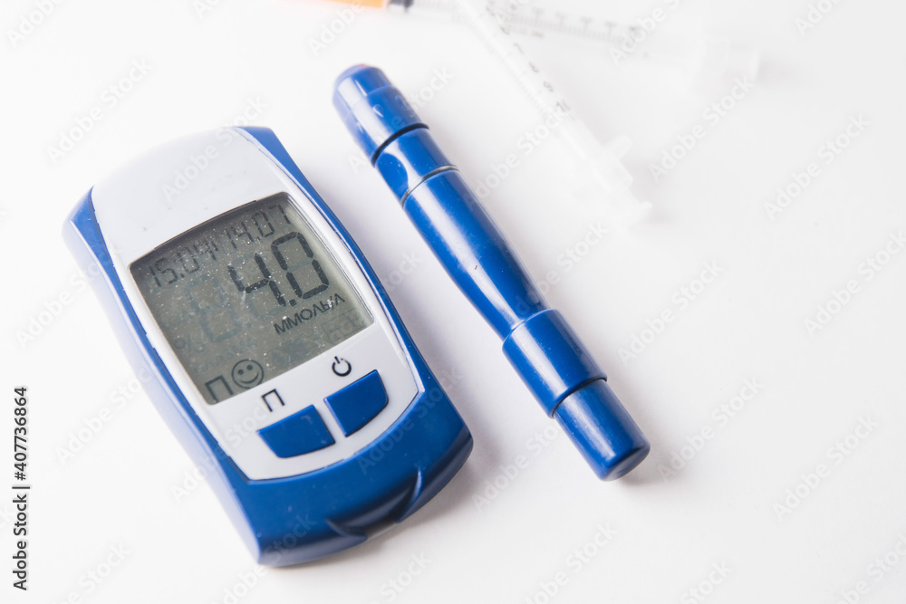 blood glucose meter on a white background. diabetes mellitus. blood glucose meter on a white background. diabetes mellitus.