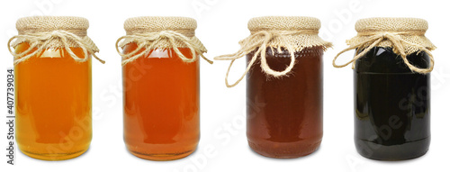 floral honeydew honey in a jar isolated over white