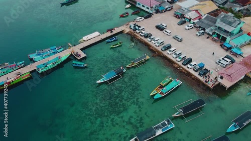 Pier with at Lampung Sea Pahawang Beach, located near the Sumatera city aerial drone and noise cloud. Resort Pahawang With a clouds on the Sky in a day. 