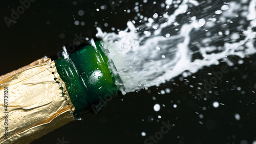 Opening a bottle of champagne.