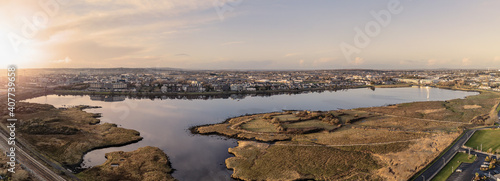 Panorama image of Lough Atalia in Galway city, Ireland. Sunset time. low sun and clean sky. Aerial view.