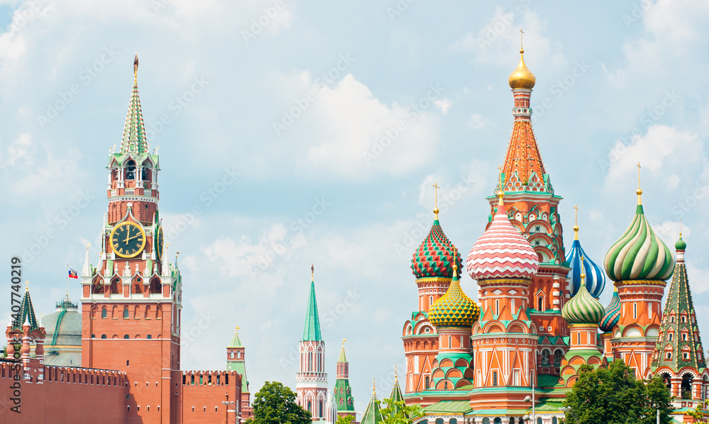 Spasskaya Tower of Moscow Kremlin and the Cathedral of Vasily the Blessed (Saint Basil's Cathedral). Red Square. Summer sunny day. Moscow. Russia