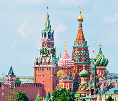 Spasskaya Tower of Moscow Kremlin and the Cathedral of Vasily the Blessed (Saint Basil's Cathedral) on Red Square. Summer sunny day. Moscow. Russia