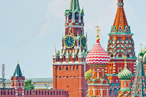 Spasskaya Tower of Moscow Kremlin and the Cathedral of Vasily the Blessed (Saint Basil's Cathedral) on Red Square. Summer sunny day. Moscow. Russia