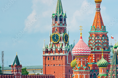 Spasskaya Tower of Moscow Kremlin and the Cathedral of Vasily the Blessed (Saint Basil's Cathedral) on Red Square. Summer sunny day. Moscow. Russia