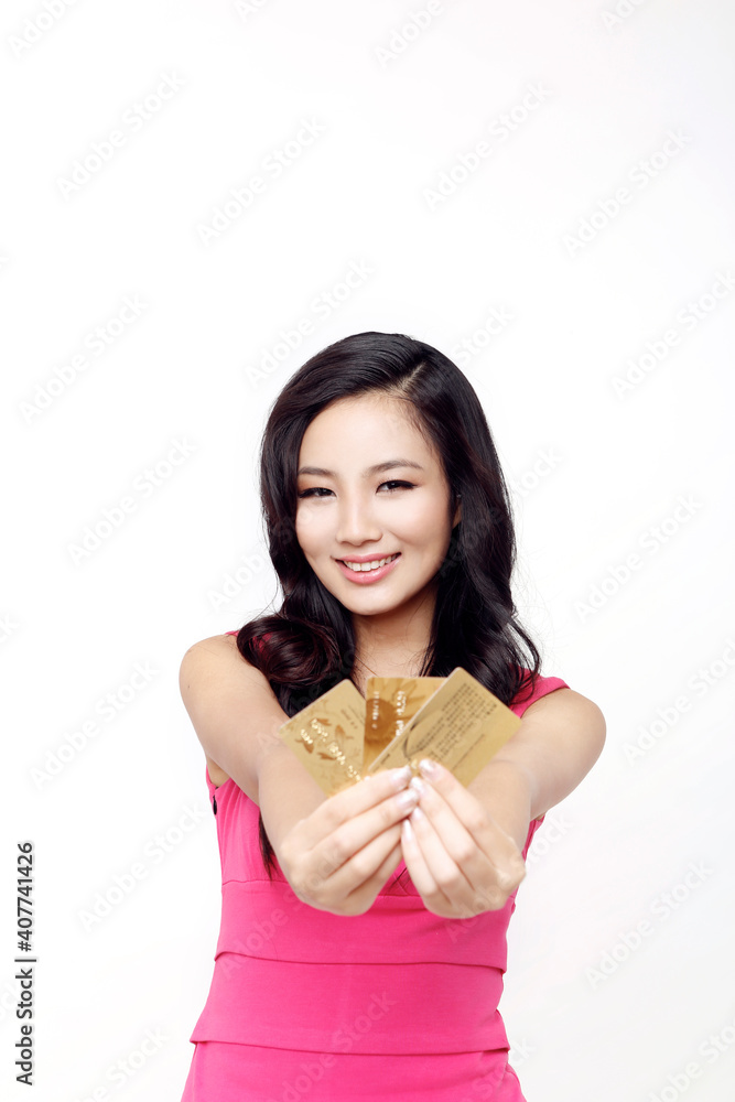 Fashion young woman holding a credit card Fashion young woman holding a credit card