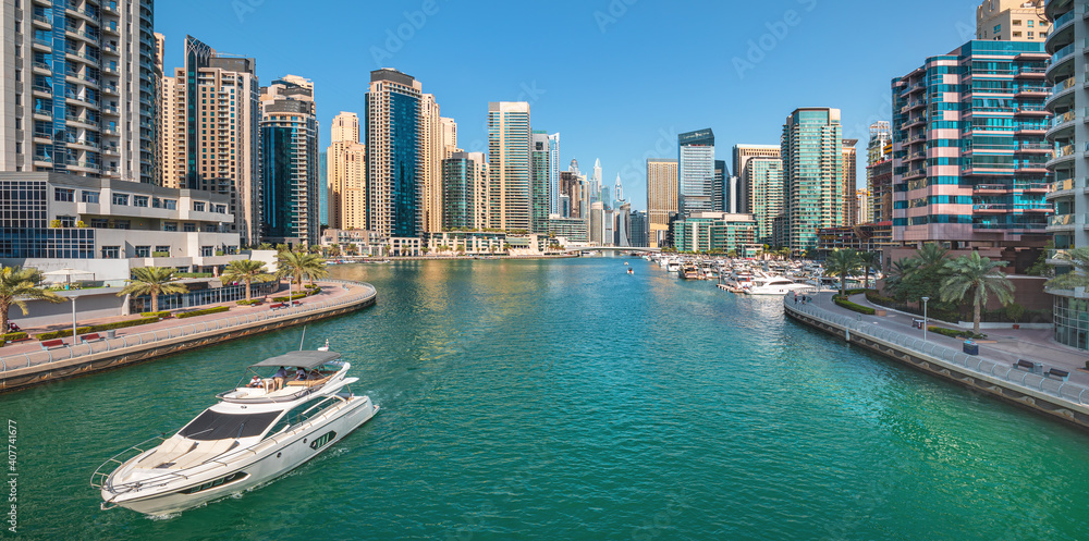 Dubai skyline with reflection in the river at sunrise , Dubai, United Arab Emirates