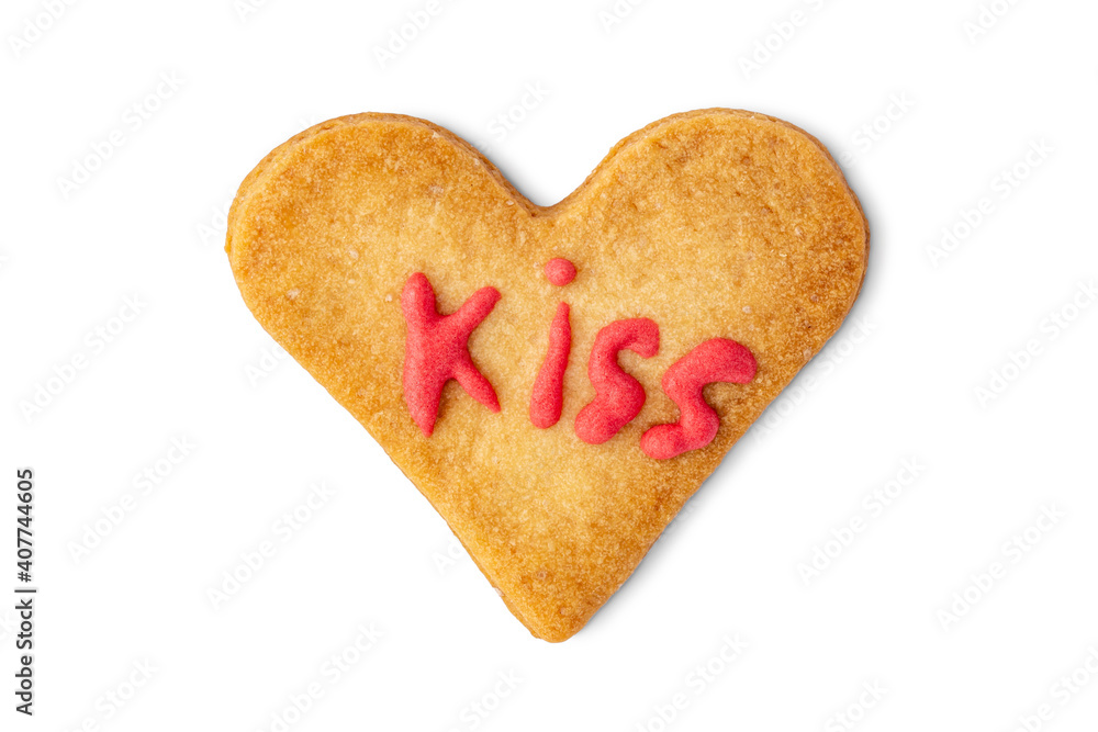 Heart shaped cookie with word KISS made of fondant isolated on white background, top view Heart shaped cookie with word KISS made of fondant isolated on white background, top view