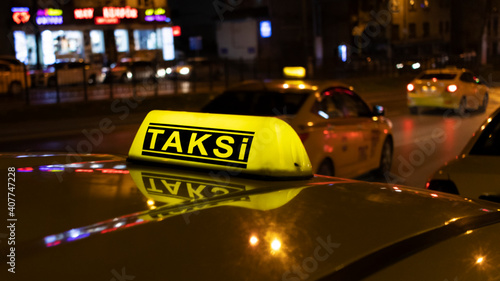 Close up of Istanbul taxi at night. The word "taksi" translated from Turkish means "taxi".